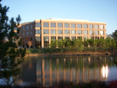 office building overlooking lake