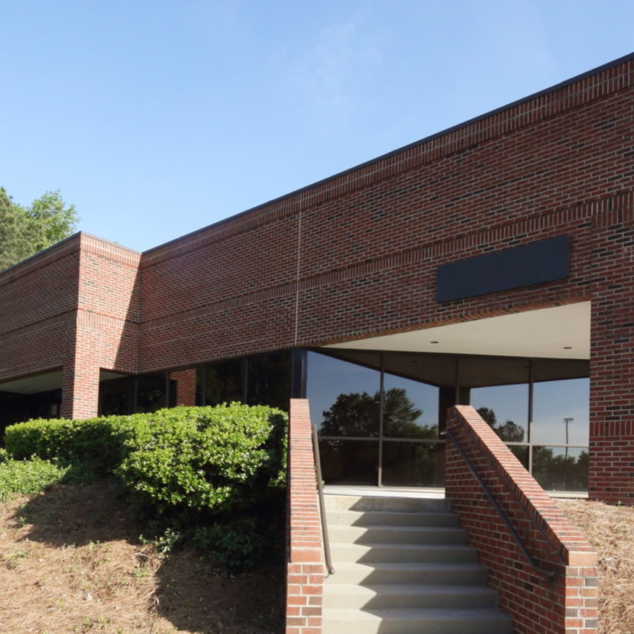 Brick Building with green grass