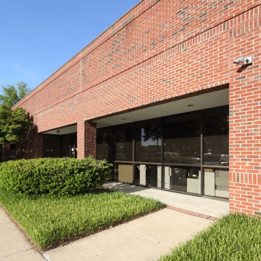 Brick Building with green grass