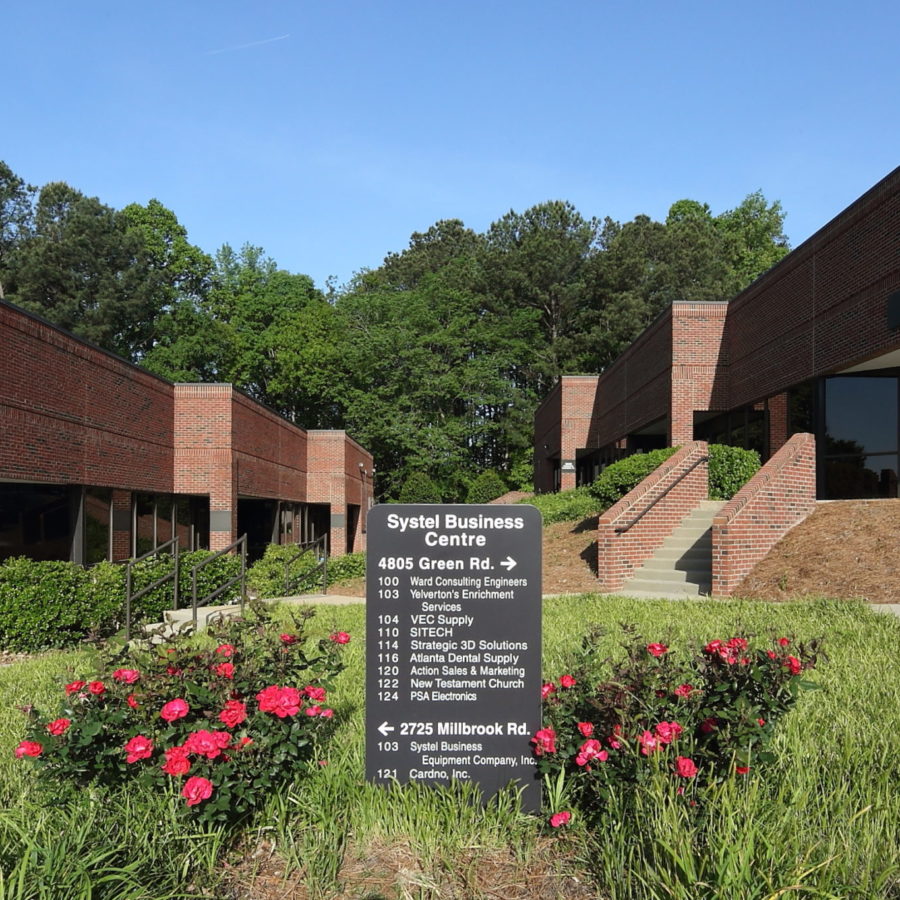 Brick Building with green grass